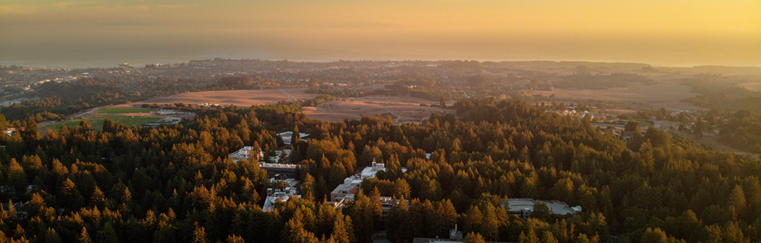 Aerial view of campus, town, bay